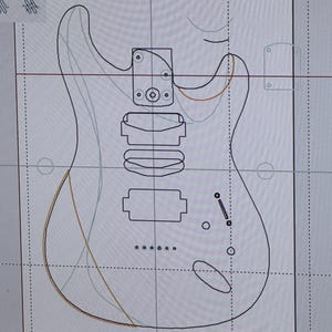 May include: A digital design of an electric guitar, shown on a computer screen. The guitar outline is black, with internal components and wiring in various colours. The word "Body" is visible at the top of the screen.