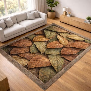 May include: Rectangular area rug featuring a realistic design of fallen leaves in shades of brown, green, and gold. The rug has a textured appearance and a neutral border, suitable for a living room or similar space.