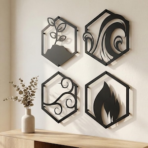May include: Four black metal wall art pieces in hexagonal frames. Designs include a plant, waves, swirling lines, and a flame. A vase with dried branches sits on a wooden surface below the art.