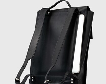 Leather Laptop Backpack with padded laptop pocket and secure magnetic closure