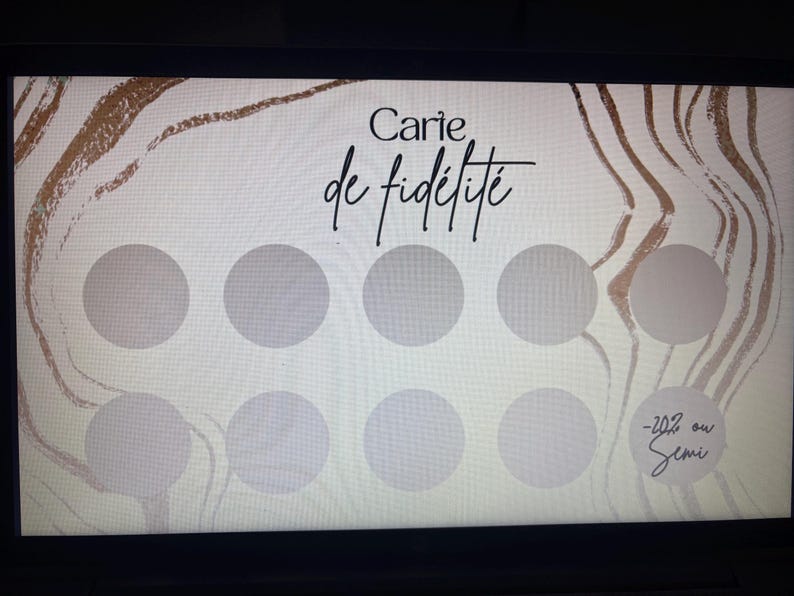 May include: A loyalty card with a light beige background and gold abstract design. The card features the text "Carie de fid&eacute;lit&eacute;" in black script, along with eight gray circles and the text "-20% ou Semi".