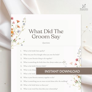 May include: A white wedding game card titled "What Did The Groom Say" with questions for the groom. The card features floral accents and the words "Instant Download". The Momentra Celebrations logo is in the upper right corner.