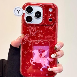 May include: Red phone case with a unicorn and pegasus design. The case has a clear, glossy finish and features a pink unicorn with wings and a pegasus. The case also has the text "The Star Gazer is telling you, You are the light".