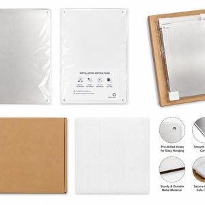 May include: A rectangular silver metal sign with pre-drilled holes at the corners. The set includes a protective plastic sleeve, a cardboard shipping box, and foam padding. The back features installation instructions and four circular detail insets.