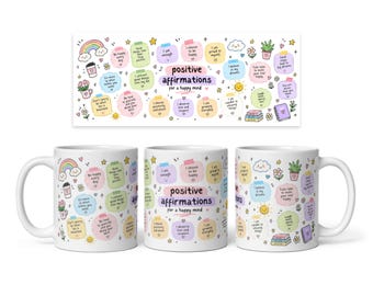 May include: A white ceramic mug featuring a colorful graphic print of positive affirmations. The design includes pastel-colored speech bubbles with text like 'positive affirmations for a happy mind', 'I am enough', and 'I choose to be happy', surrounded by small illustrations of rainbows, flowers, and stars.