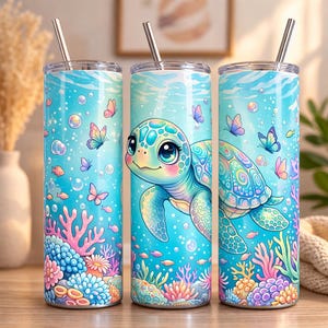 May include: Three turquoise insulated tumblers with stainless steel straws. Each tumbler features a colorful underwater scene with a cartoon sea turtle, butterflies, fish, bubbles, and coral. The design is vibrant and whimsical.