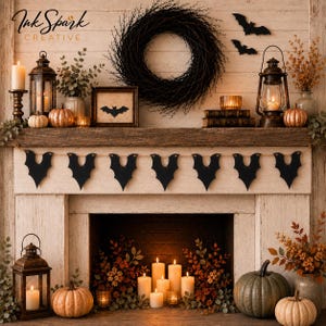 May include: A fireplace mantel decorated for Halloween with a black twig wreath, a bat-shaped paper banner, two metal lanterns with lit candles, small pumpkins, and a framed bat silhouette. The scene includes autumn foliage and additional candles.
