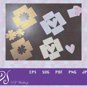 May include: A set of four paper craft boxes featuring a heart and clover design. The boxes are made from white, gold, and pink paper. These boxes are ideal for holding small gifts or favours.