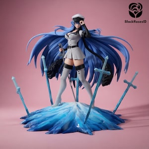 May include: Figurine of a woman in a military-style uniform, with long blue hair and a white hat. She holds a sword and stands on a blue, icy base, surrounded by blue swords. The background is pink, and the text "BlackRosesID" is in the upper right corner.