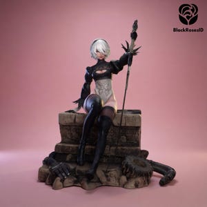 May include: A detailed figurine of a female character with white hair, wearing a black and white outfit, and holding a sword. The figure is seated on a stone structure with a pink background. The BlackRosesID logo is in the upper right corner.