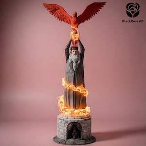 May include: A detailed statue of a wizard holding a fiery phoenix aloft. The wizard is dressed in a long gray coat and hat, with a long white beard. The phoenix is red, and flames surround the wizard and base. The base is made of gray brick.