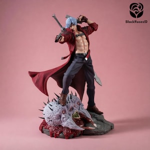 May include: A detailed action figure of a character with silver hair, wearing an open red coat, dark trousers, and brown boots. The figure holds a handgun and a sword, standing atop a textured, pale, monstrous base with red accents.