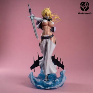 May include: A collectible anime-style figurine featuring a character with blonde hair, wearing a white open jacket, a dark belt, and long white pants. The figure holds a silver sword aloft and stands atop a translucent blue water-like base.