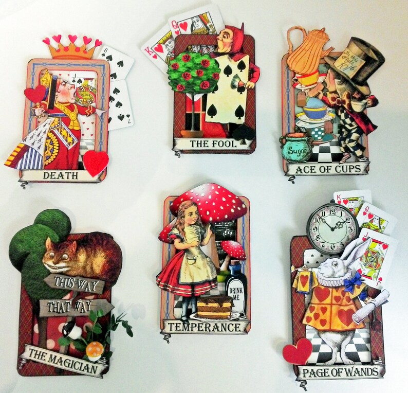 May include: A set of ten illustrated tarot cards featuring characters and scenes from Alice in Wonderland. The cards are decorated with colorful details and include the names "Death", "The Fool", "Ace of Cups", "Temperance", "The Magician", and "Page of Wands".