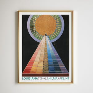 May include: A framed abstract art print featuring a colorful pyramid shape ascending towards a sun-like circle. The artwork has a gold frame and the text "LOUISIANA7.3-6.7HILMAAFKLINT" at the bottom. The color palette includes red, orange, yellow, blue, and green.