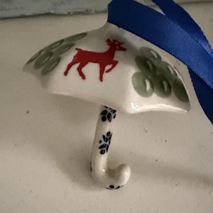 May include: A rustic wooden sign with the text "Welcome to our home" in white lettering. The sign features a distressed finish and a simple, inviting design, perfect for a front porch or entryway.