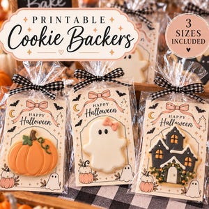May include: Three clear plastic bags containing decorated cookies on printed cardstock backers. The cards feature Halloween designs with pumpkins, ghosts, and a haunted house, each tied with a black and white gingham ribbon.