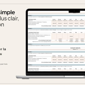 May include: A laptop displays a financial budget template with rows and columns for tracking income and expenses. The screen shows text in French, including "budget simple" and "charge mentale." The laptop is on a light beige surface.