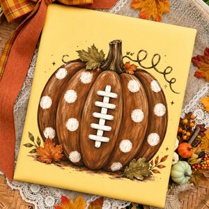 Football pumpkin PNG on a mustard yellow t-shirt mockup featuring a hand-painted pumpkin with football laces, ideal for football mom game day shirts, fall football season, pumpkin football apparel, and autumn sports lovers.