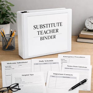 May include: A white binder labeled "SUBSTITUTE TEACHER BINDER" sits on a wooden desk. Several sheets of paper with headings like "Welcome Substitute!" and "Daily Schedule" are scattered around. A pen, pencils, and a clock are also visible.