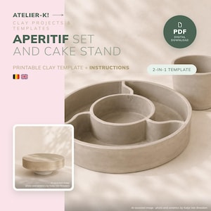May include: A digital PDF template for an aperitif set and cake stand by Atelier-K. The image displays a circular, multi-compartment clay tray and a separate cylindrical container, alongside a smaller inset showing a raised cake stand design.
