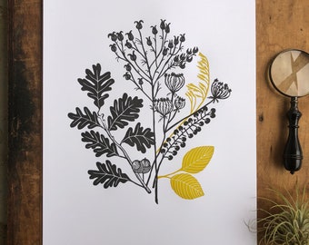 May include: Black and gold botanical print featuring a variety of leaves and flowers. The print is on white paper and has a minimalist style.