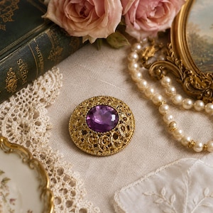 Vintage Purple Rhinestone Brooch Gold Tone Filigree Pin Oval Jewelry Amethyst Colored Crystal Floral Estate Accessory Great Condition