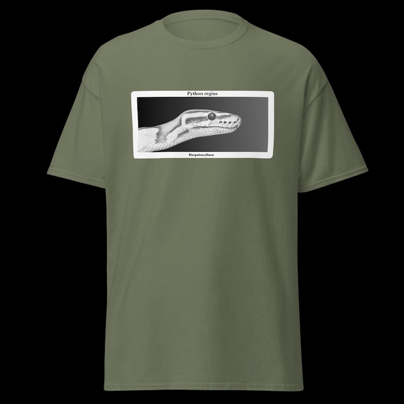 May include: Olive green t-shirt featuring a black and white illustration of a snake's head within a white rectangle. The text "Python regius" is above the image, and "Herpetoculture" is below.