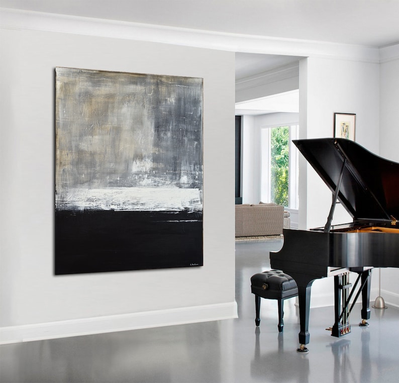 May include: Abstract painting in shades of gray, white, and black, hanging on a white wall in a modern living room with a black grand piano in the foreground.