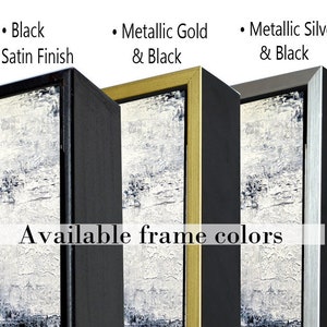 May include: A close-up of eight different frame colors for artwork. The colors are white, maple, black, metallic gold and black, metallic silver and black, solid gold metallic, and solid silver metallic. The text "Available frame colors" is displayed below the frames.