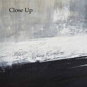 May include: Abstract painting with a gray, white, and black color scheme. The painting has a horizontal stripe pattern with a thick black stripe at the bottom.