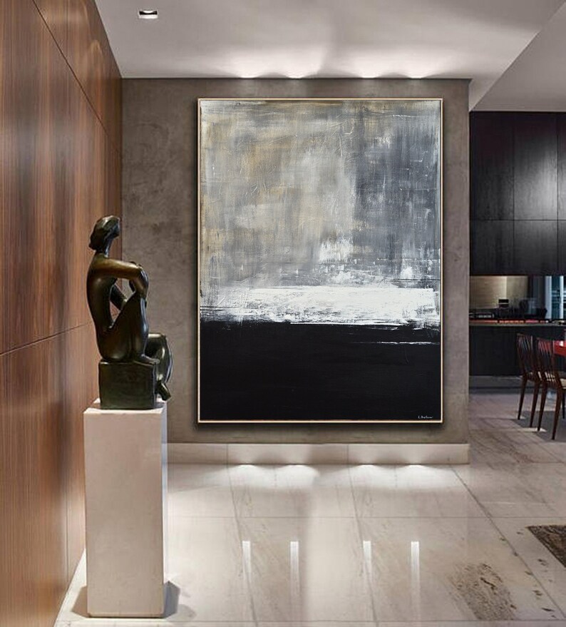 May include: Abstract painting with a black, white, and gray color scheme. The painting is on a large canvas and is hanging on a wall in a modern home.