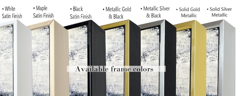 May include: A close-up of eight different frame colors for artwork. The colors are white, maple, black, metallic gold and black, metallic silver and black, solid gold metallic, and solid silver metallic. The text "Available frame colors" is displayed below the frames.