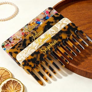 May include: Four rectangular hair combs with wide teeth, each featuring a unique pattern including multicolored confetti, dark tortoiseshell, cream marble, and light tortoiseshell, with the names Aeliana, Jelissa, Emily, and Sophia in gold script.