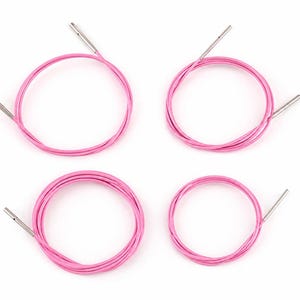 May include: Four pink circular knitting needle cables arranged in a grid. Each flexible cable features a smooth, metallic silver connector at both ends, designed for attaching interchangeable needle tips to create various circular knitting projects.