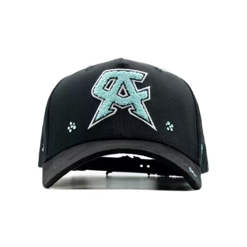 May include: Black baseball cap featuring a stylized "CA" logo in light blue with white trim on the front. The cap has a curved brim and small, light blue floral accents. The hat is made of a durable material.