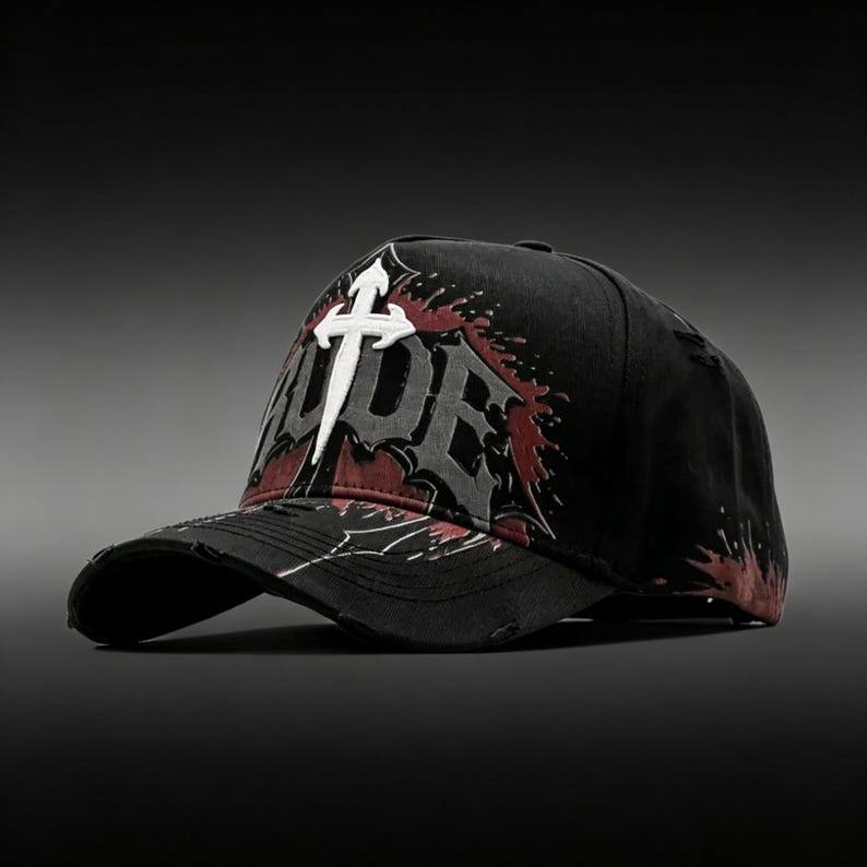 May include: Black baseball cap with a distressed design. The cap features the word "HYPE" in a white, stylized font, with a cross symbol above the "E". Red and gray accents add to the design.