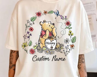 Camiseta personalizada con dibujo floral de Winnie the Pooh de Disney, conjunto a juego para grupos de Winnie the Pooh y sus amigos, Piglet, Tigger y Eeyore para un viaje familiar a Disneyland WDW.
