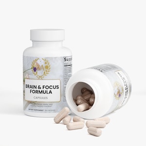 May include: Two white supplement bottles with the text "BRAIN & FOCUS FORMULA CAPSULES". One bottle is upright, the other is tipped over, spilling beige capsules. The bottles have a floral design and the text "Supports focus, clarity, and healthy memory function".