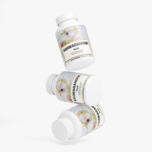 May include: Three white supplement bottles with the text "ASHWAGANDHA PLUS" in a gold frame. The bottles have a floral design and the text "Supports energy, vitality and overall wellness". The bottles are stacked.