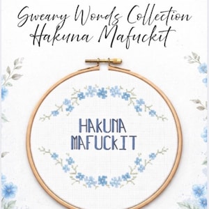 May include: A cross-stitch pattern featuring the phrase "Hakuna Mafuckit" in blue letters, surrounded by a floral design. The design is set within a wooden embroidery hoop, with the words "Sweary Words Collection" above.