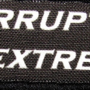 May include: Black fabric label with white text that reads "CORRUPTUS IN EXTREMIS".