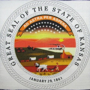 May include: The Great Seal of the State of Kansas features a sunset scene with a covered wagon, a steamboat, and a cabin. The seal is surrounded by a rope border and the text "Great Seal of the State of Kansas" and "Ad Astra Per Aspera". The date "January 29, 1861" is printed below the seal.