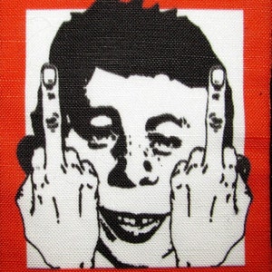 May include: A white patch with a black and white illustration of a person giving the middle finger with the text "GET MAD!" above the illustration and a red background.