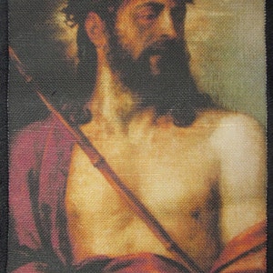 May include: A painting of a man with a crown of thorns and a beard, wearing a purple robe. He is holding a wooden staff in his left hand. The painting is done in a realistic style and the man's expression is solemn.