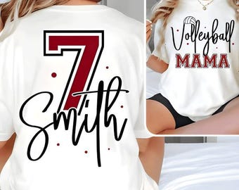Camiseta personalizada com nome e número de jogadora de vôlei, estilo "Mãe de Jogadora de Vôlei", ideal para torcer pelo seu time nos dias de jogo. Disponível para download digital por sublimação.