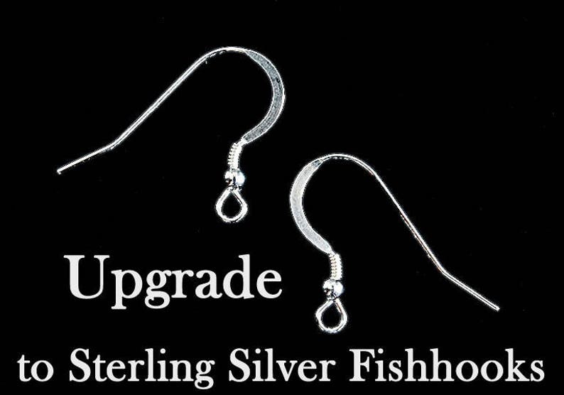 May include: Two silver fishhook earring findings. The text "Upgrade to Sterling Silver Fishhooks" is below the image.