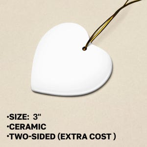 a white heart shaped object with a string attached to it