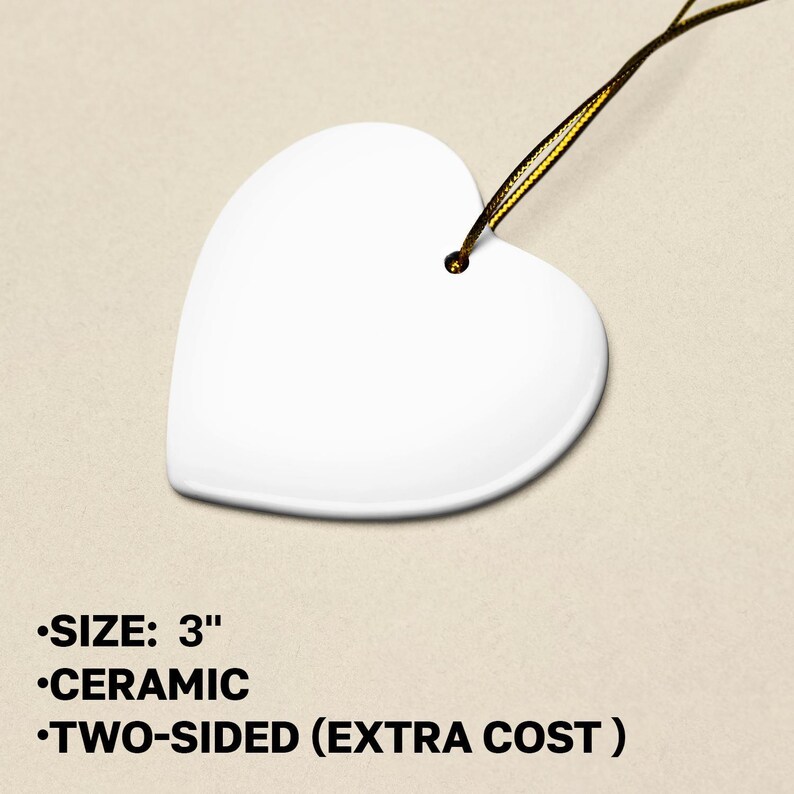 a white heart shaped object with a string attached to it