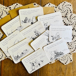 May include: A collection of Winnie-the-Pooh themed cards with quotes from the book. The cards feature black and white illustrations of Winnie-the-Pooh and his friends. The quotes include: "Love is taking a few steps backward maybe even more to give way to the happiness of the person you love." "If there ever comes a day when we can't be together, keep me in your heart, I'll stay there forever." "A day without a friend is like a pot without a single drop of honey left inside." "A late consideration, a little thought for others, makes all the difference." "We didn't realize we were making memories, we just knew we were having fun." "Sometimes the smallest things take up the most room in your heart." "We'll be Friends Forever, won't we?" asked Piglet. "Even longer," Pooh answered.